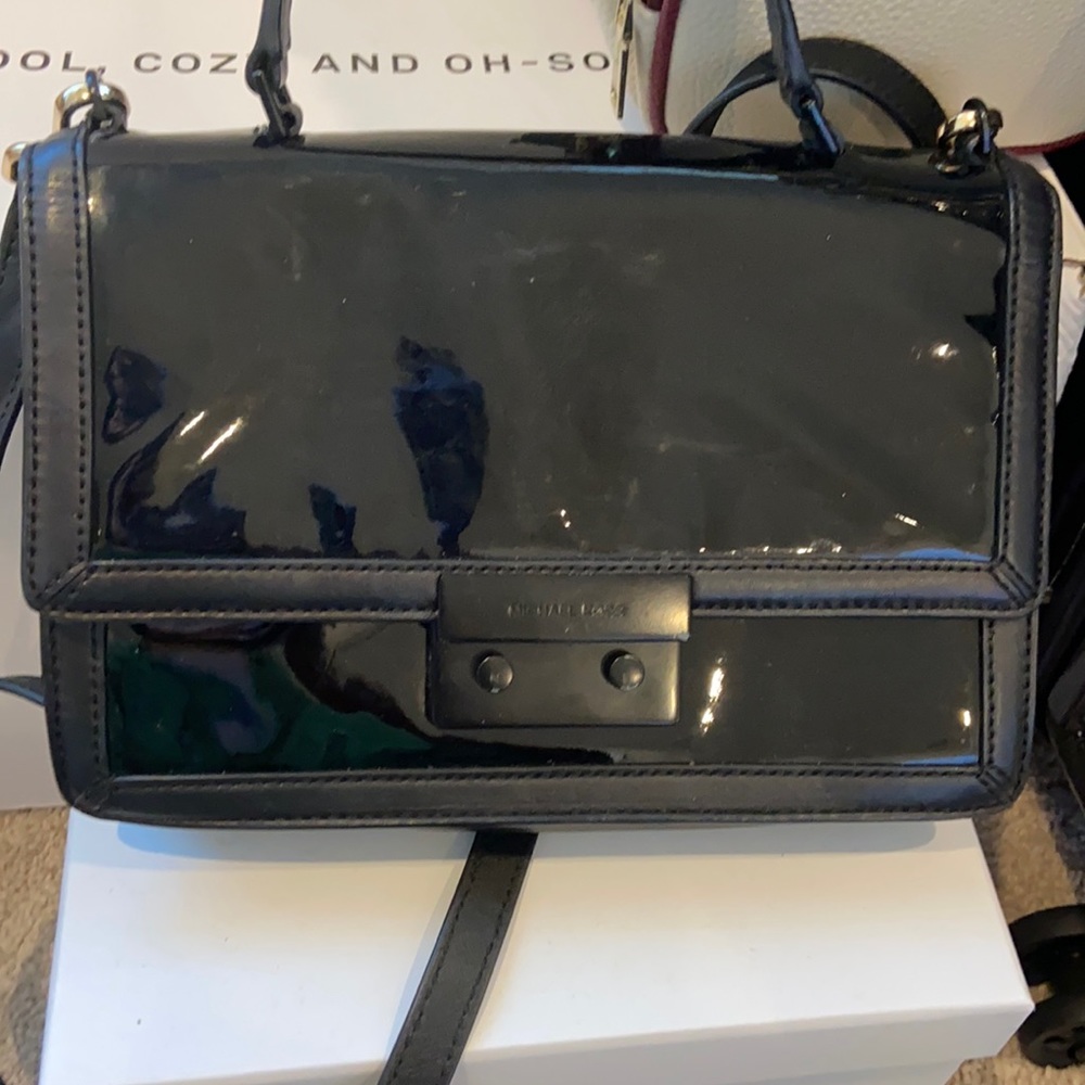 Black patent leather Michael kors bag.